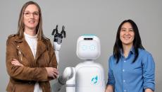 Diligent Robotics cofounders Andrea Thomaz and Vivian Chu with the Moxi robot