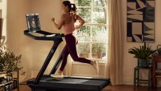 A person exercising on a Peloton treadmill