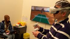 A volunteer participant of the Flinders University research using VR to do an exercise
